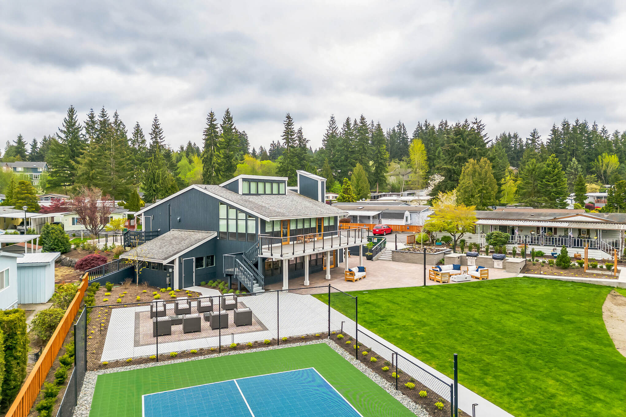 Aerial view of manufactured home fitness gym and tennis court